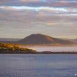 Cullunghutti Mountain hiding behind the sea mist of early morning at Culburra Beach South Coast NSW.